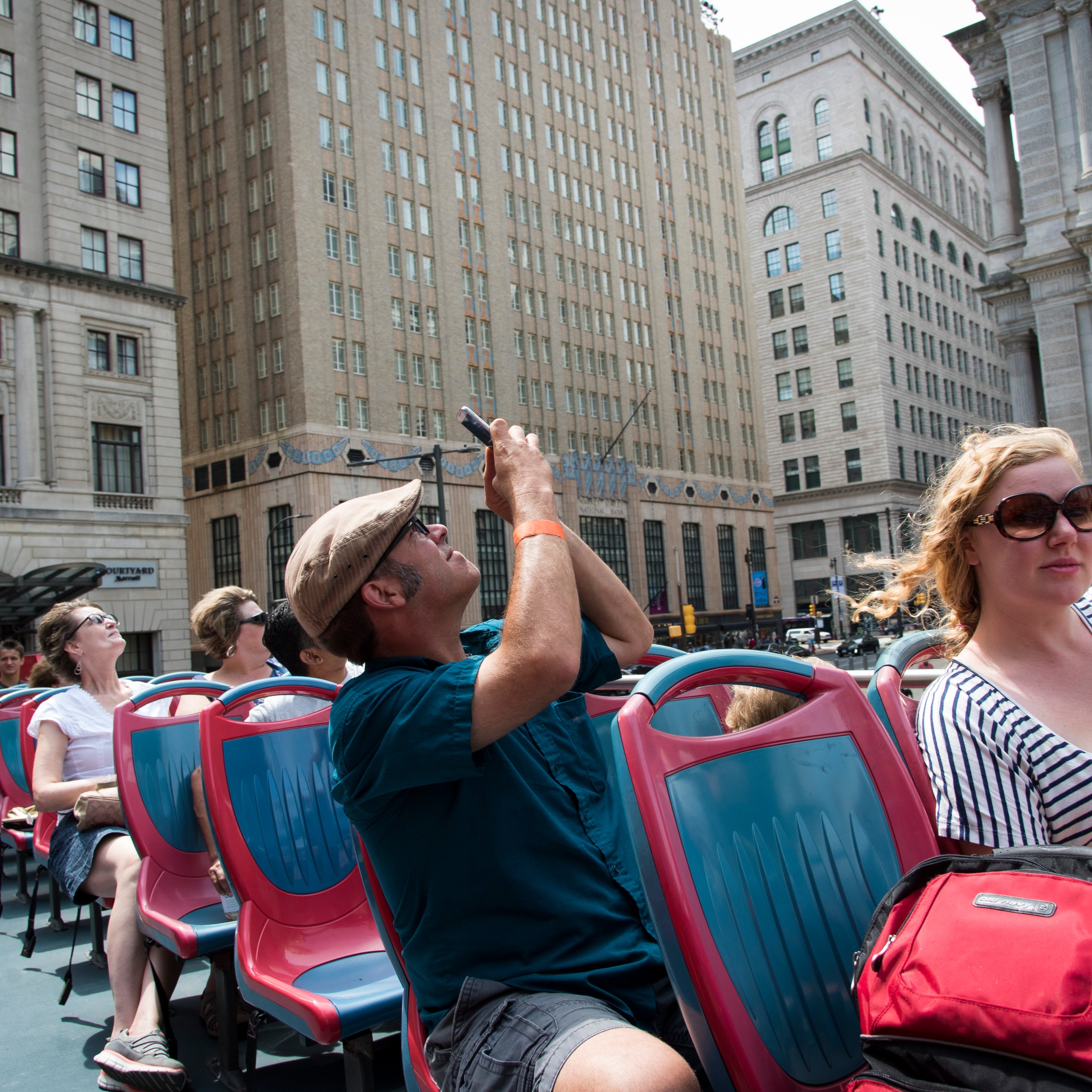 Philadelphia Sightseeing Tours passengers taking pictures of the city on the tour