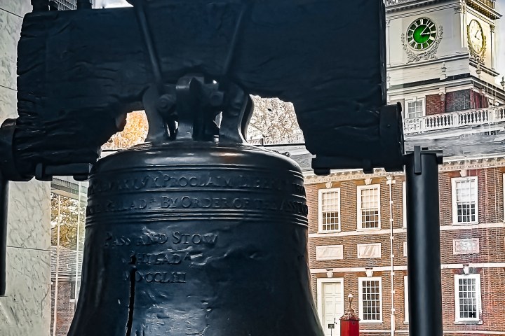 a bell with Liberty Bell in the background