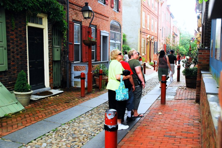 a person walking down a sidewalk