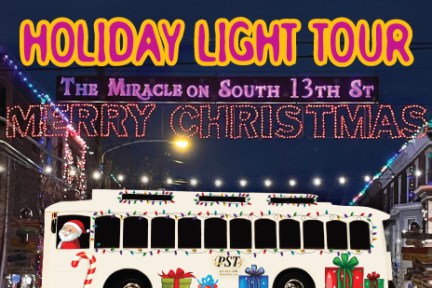 Festive bus with gifts beneath 'Holiday Light Tour' and 'Merry Christmas' signs on a decorated street.